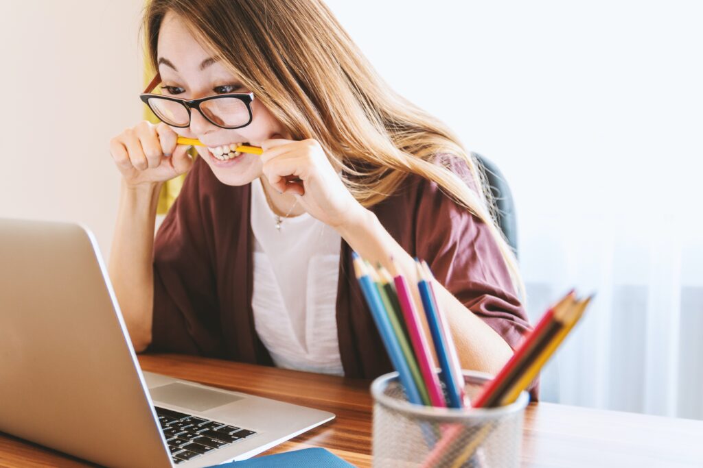 girl with the pencil in her mouth